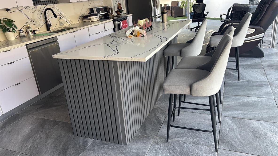 Modern kitchen with fluted panel island and marble quartz countertop