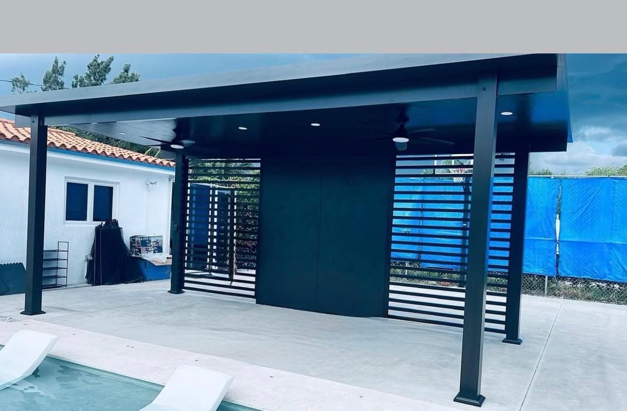 Black steel pergola with horizontal louver privacy screens by pool